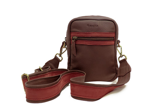 A crossbody with a compartment zipper and side pocket.