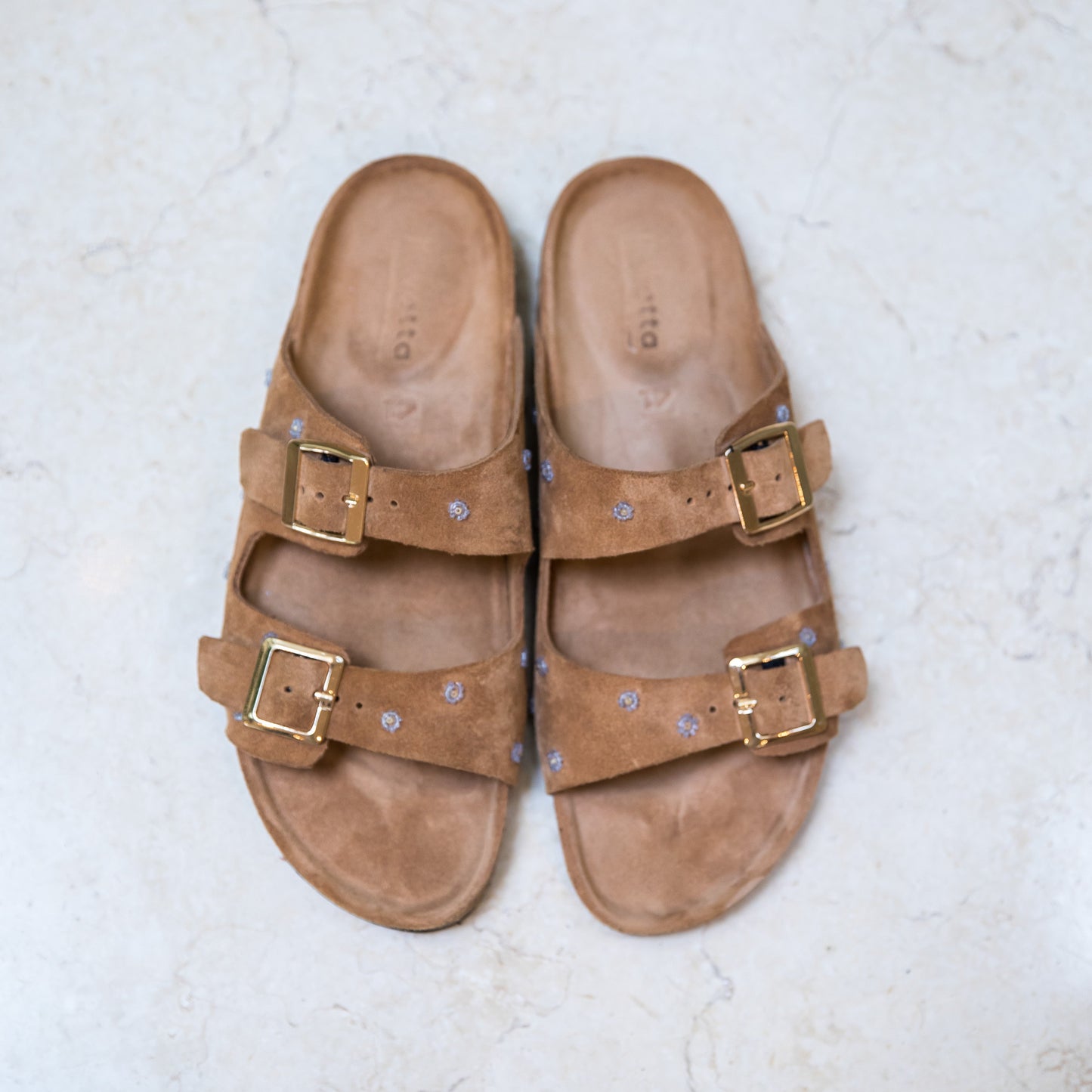 Beige suede Isla cork footbed sandals by Ikwetta, handcrafted in Kenya.