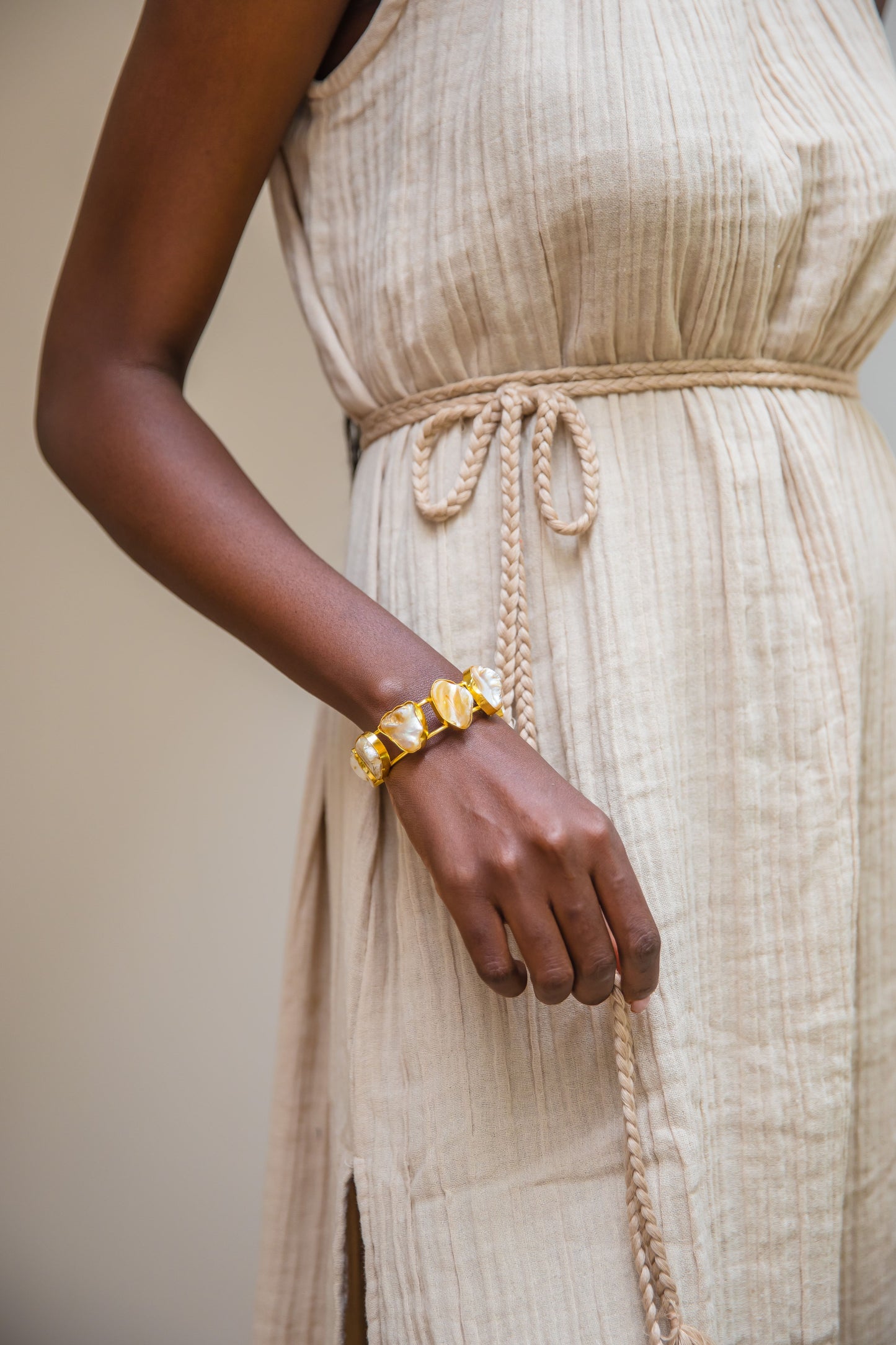 Honey Nairobi halter dress with artisanal handwoven neckline and flowing double cheesecloth.