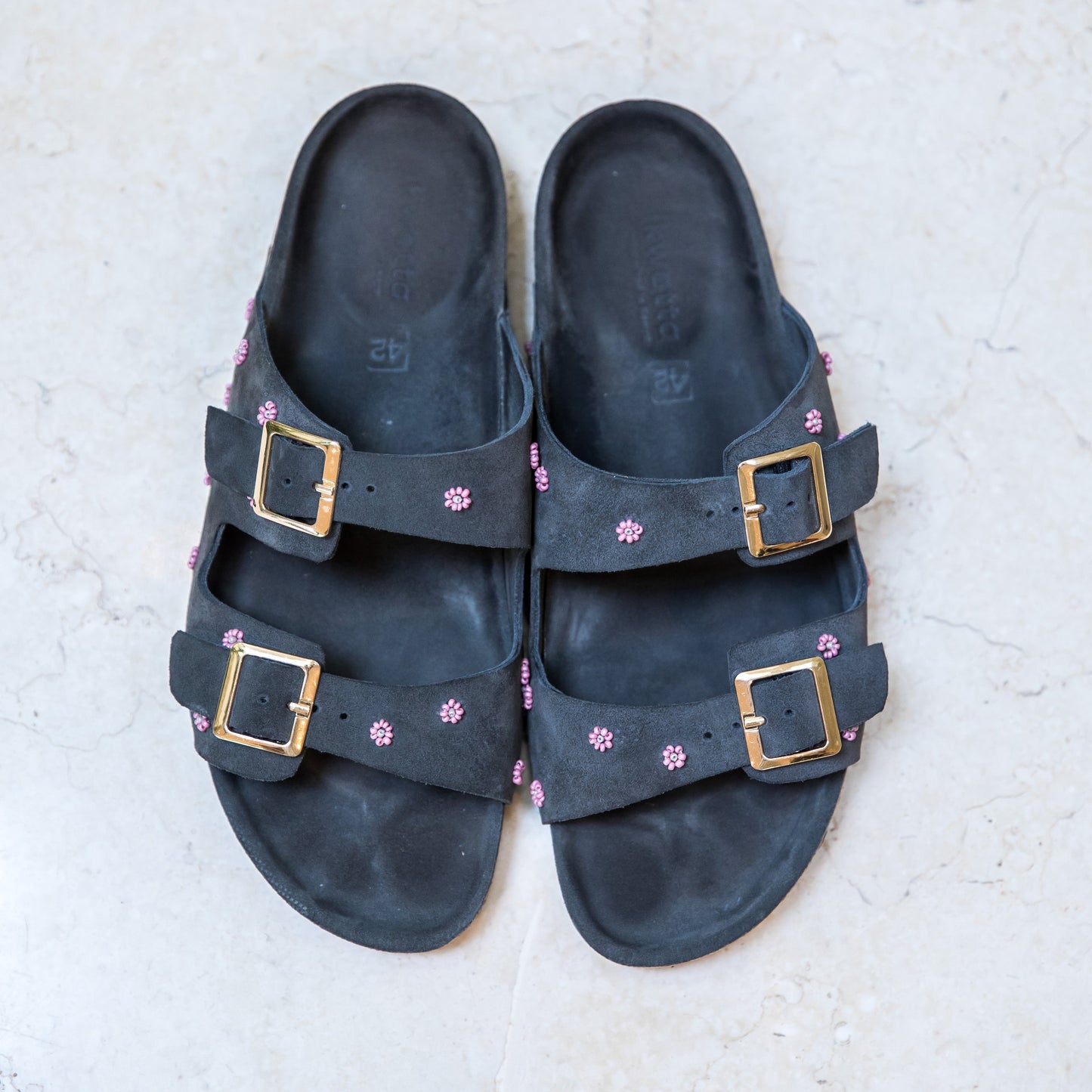 Grey suede cork footbed sandals with delicate floral embellishments by Ikwetta.