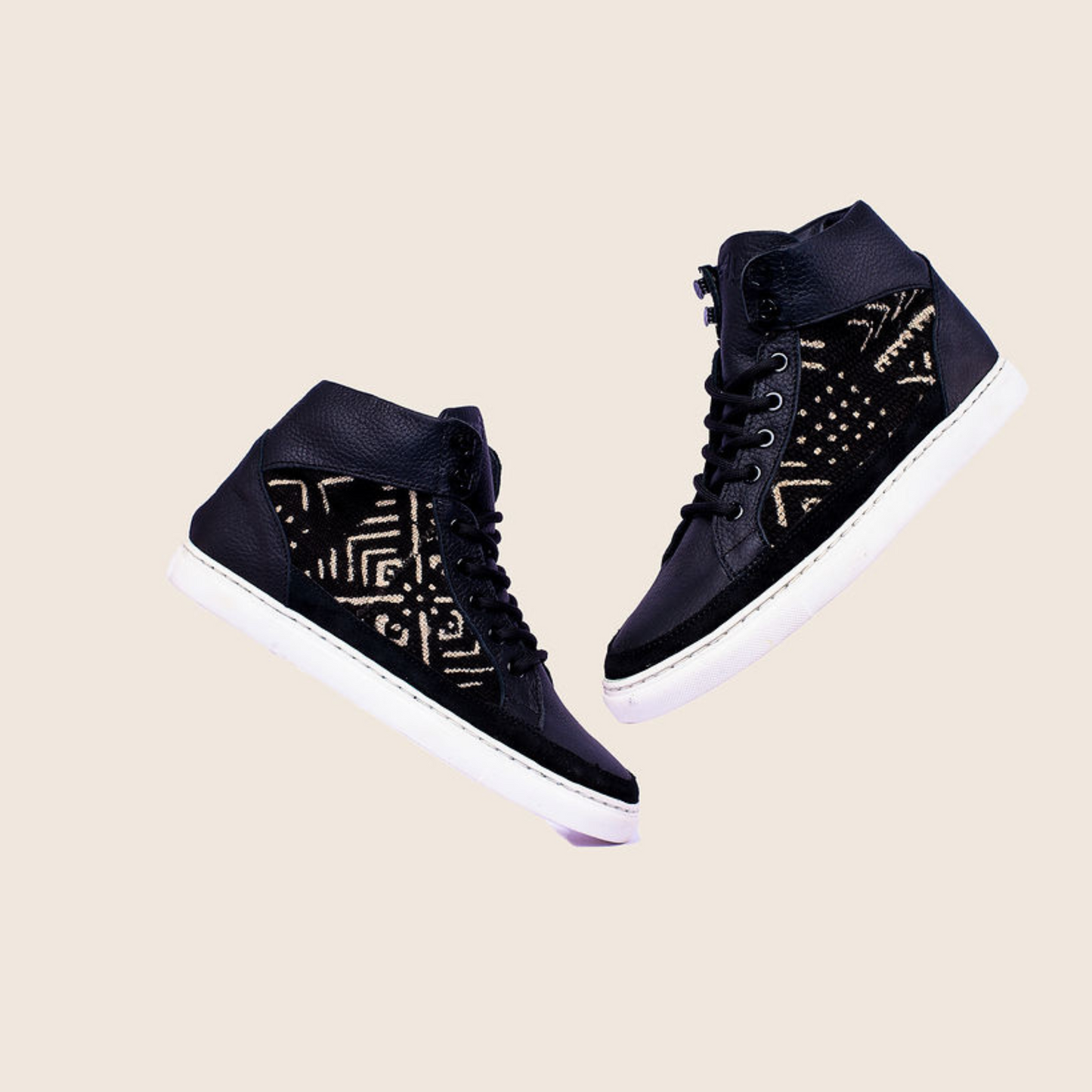 Hightop mudcloth sneaker in Black milled leather, mudcloth material and royal soles
