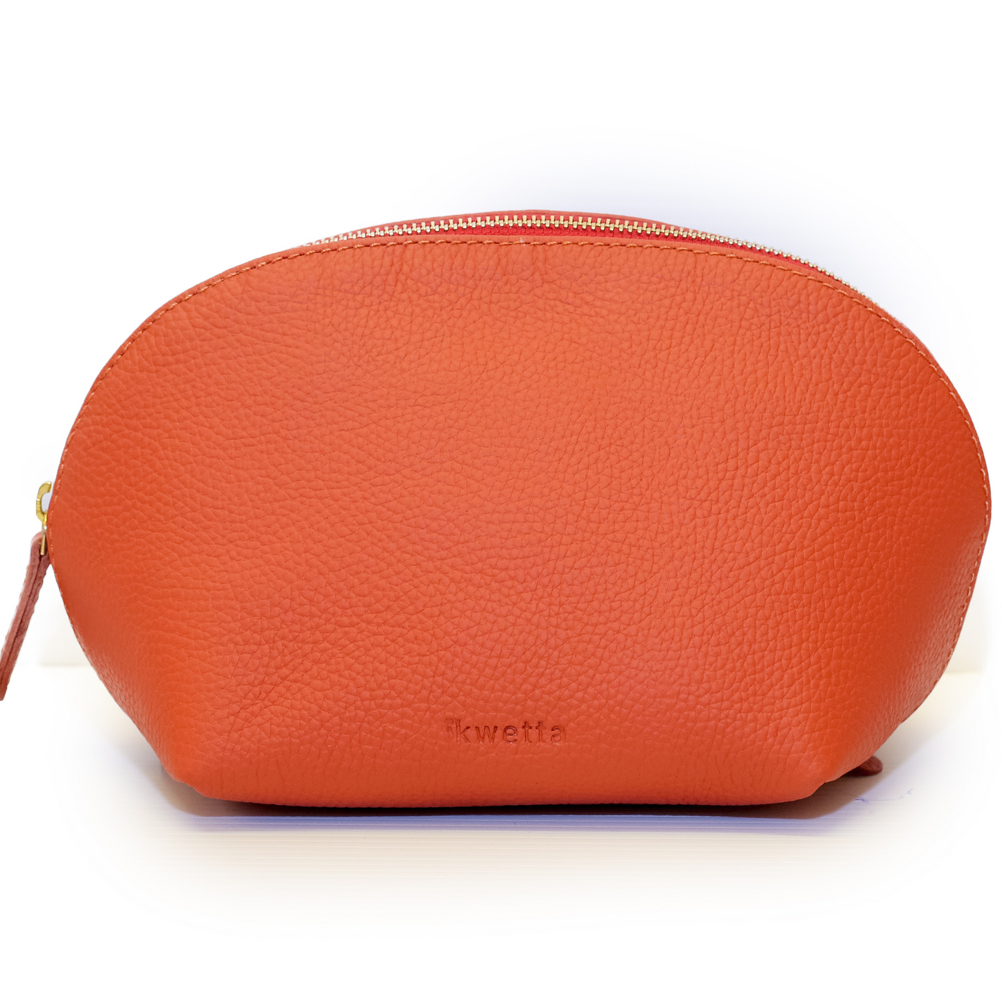 Viringo travel case in burnt ciena natural dyed milled leather