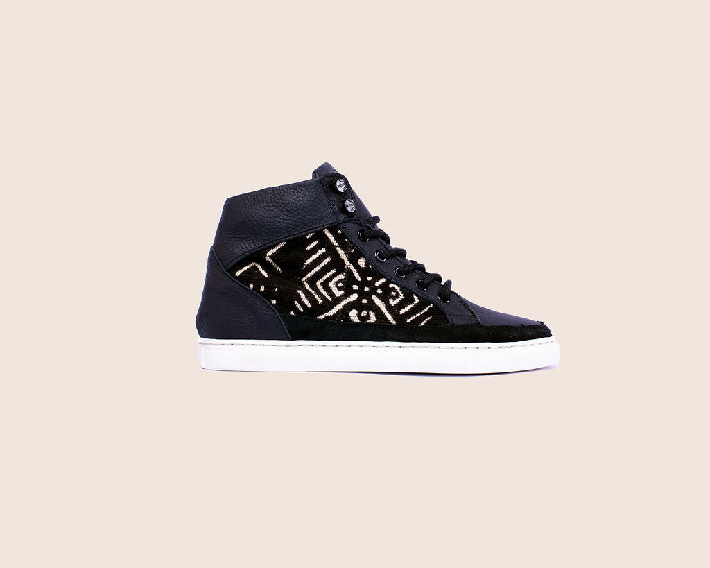 Hightop mudcloth sneaker in Black milled leather, mudcloth material and royal soles