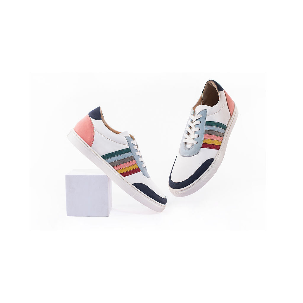Maximallist sneaker in white milled leather, suede side straps and royal soles.